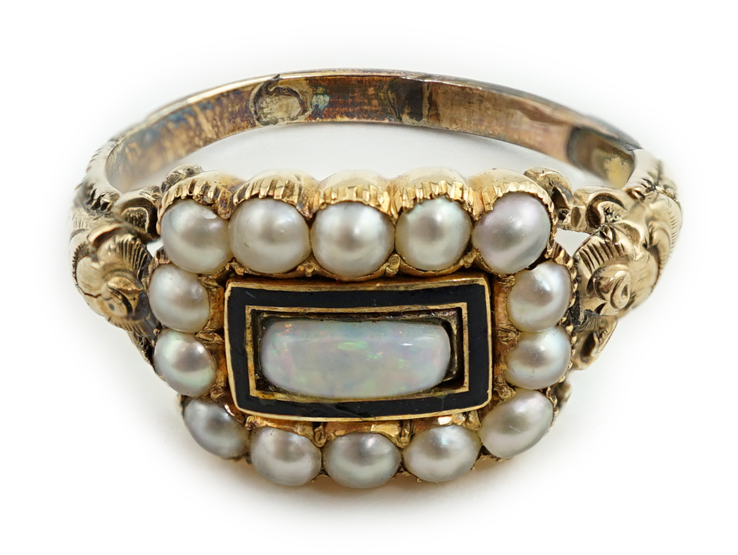 An early Victorian gold, enamel and split pearl mourning ring